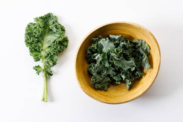 istock Fresh green Kale leaf salad vegetable on white background 2151516811