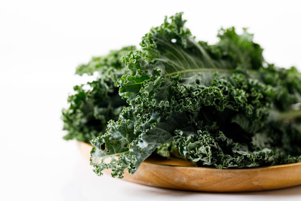 istock Fresh green Kale leaf salad vegetable on white background 2151516822