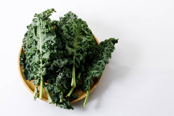 istock Fresh green Kale leaf salad vegetable on white background 2151516825