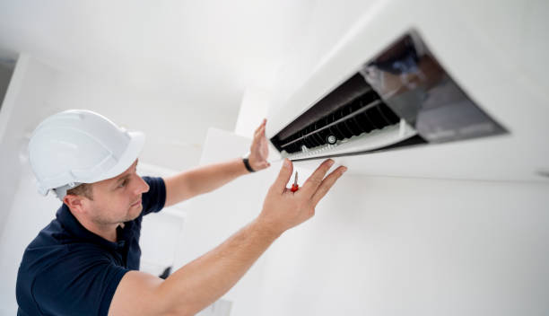istock technician cleans air conditioner system in a modern apartment. 2151517571