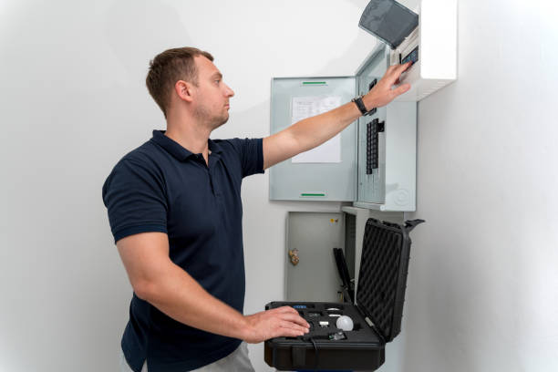 A technician works with a demo kit of the smart home system