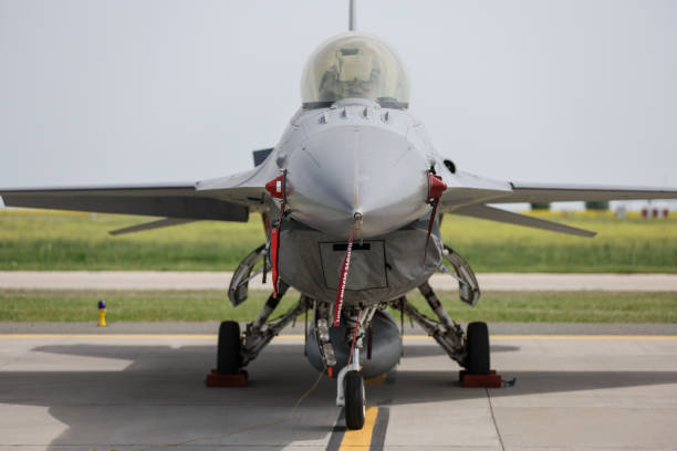 istock Fighter jet in parking position with red remove before flight ribbon attached 2151519389