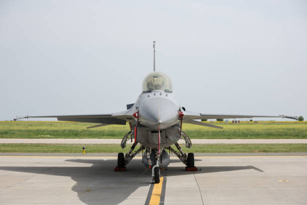 istock Fighter jet in parking position with red remove before flight ribbon attached 2151519395