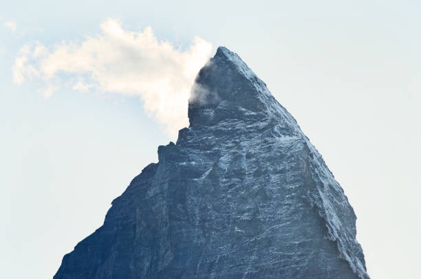 Majestic Swiss Alps: Snow-capped peaks tower above Grindelwald, creating a breathtaking winter wonderland, perfect for hiking, skiing, and ice skating, in a quintessentially Swiss landscape.