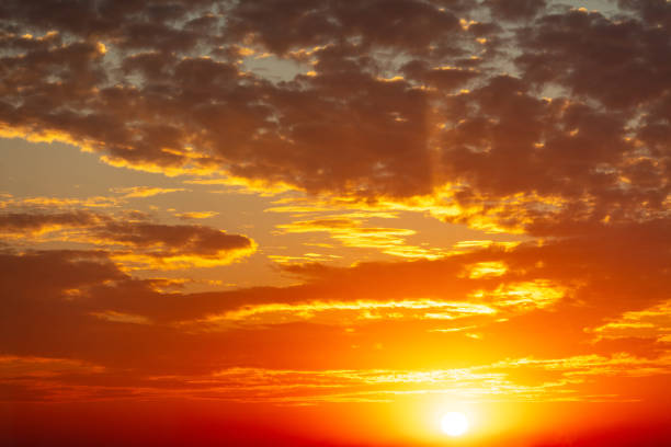 istock Golden sunset on the sky with clouds 2151521853