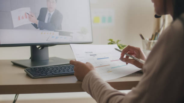 istock Businesswoman Analyzing Project Timelines in Video Call. 2151522616