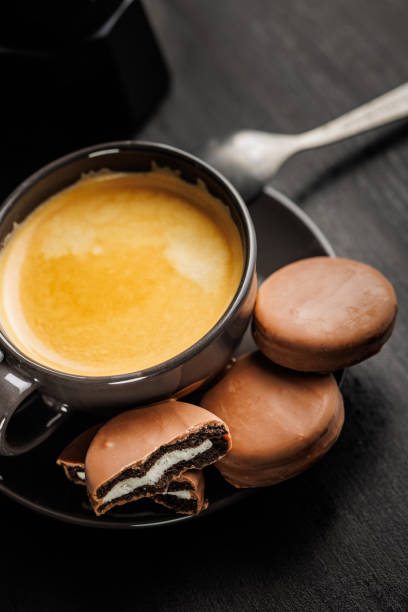 Freshly Brewed Coffee in Cup With Chocolate Cookies on a Saucer