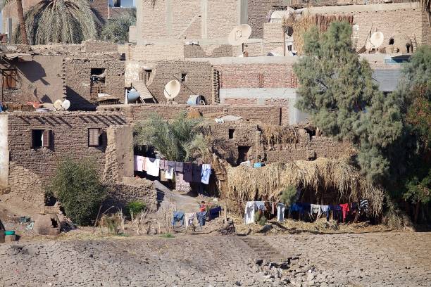 Village along the Nile river between Luxor and Aswan, Egypt. Landscape and fisherman