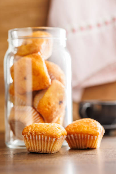 Magdalenas the typical spanish plain muffins on a wooden table.