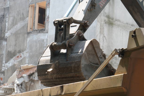 Demolition images of the old building for which an urban transformation decision was made. Close-up excavator's bucket demolishes the building. We must make our houses earthquake resistant.