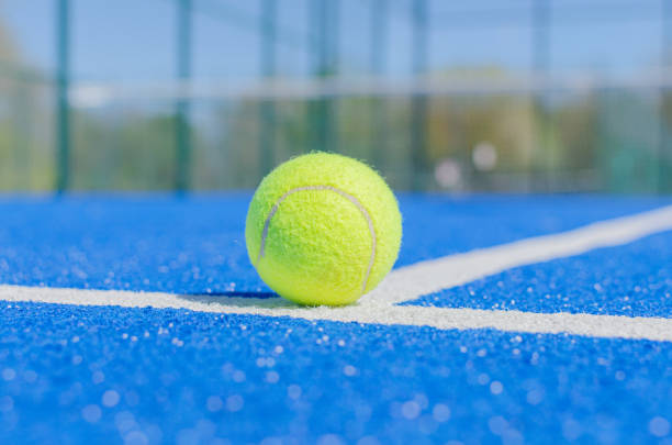 istock Padel ball on blue padel court 2151524124