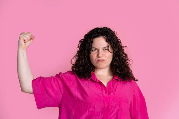 istock Empowered woman making strong fist gesture 2151524228