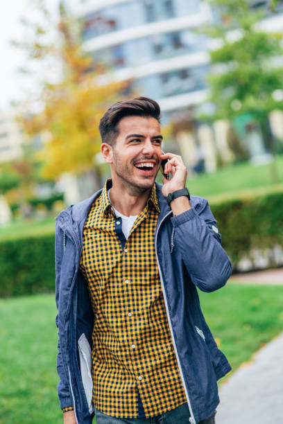 istock Young man talking to the phone 2151525655