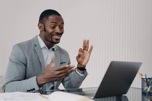 istock Smiling businessman gesturing 