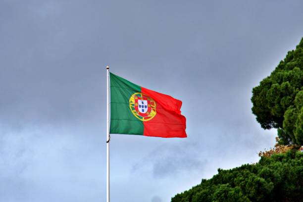 istock Portuguese flag waving in the wind 2151527325