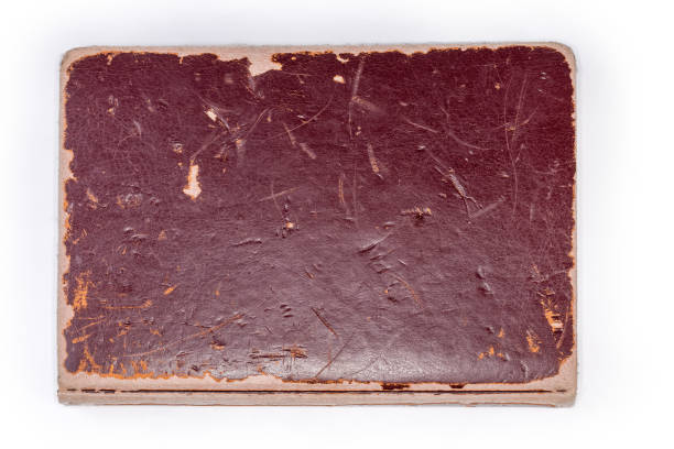 istock Closed old shabby book on a white background 2151527845