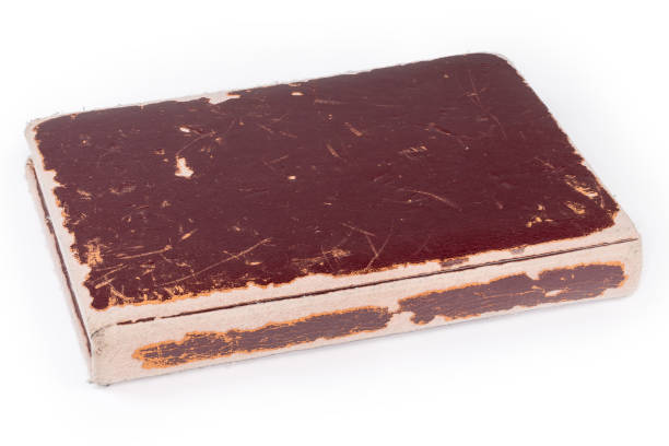 istock Closed old shabby book on a white background 2151527917