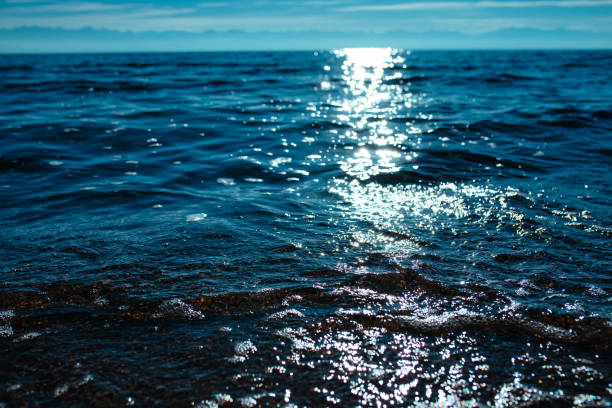 istock Seawater surface with sun glare 2151530526
