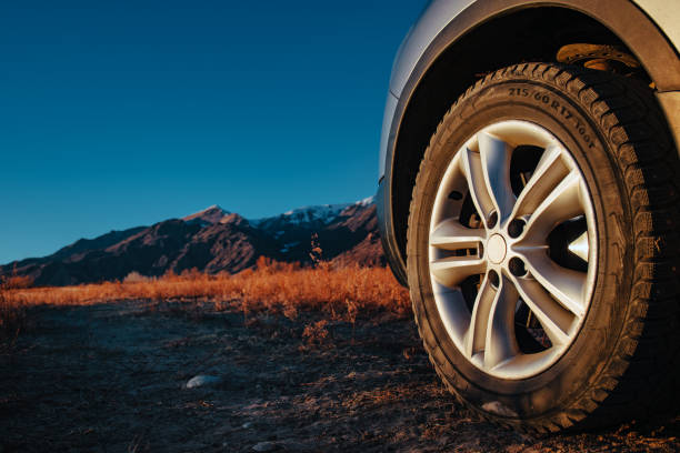 istock Car wheel offroad closeup view at twilight 2151530659