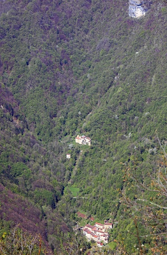 group of very few houses in the remote district in the woods on the slopes of the mountain