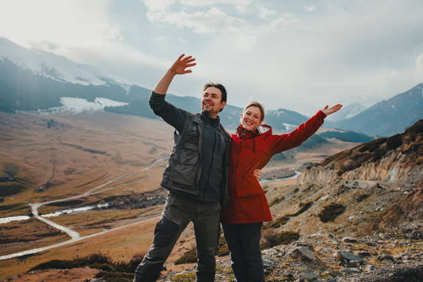 Free Stock Photo of Couple Standing on Mountain Top | Download Free ...