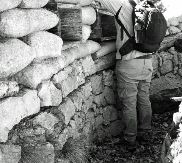Three WWII Soldiers Defending Their Position.  Guns and Bayonetts out and ready.  This image has a \