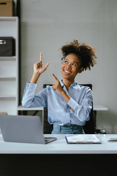 istock Happy young businesswoman presenting or pointing, happy working. 2151532063
