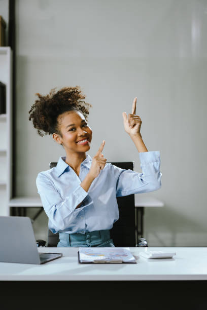 istock Happy young businesswoman presenting or pointing, happy working. 2151532078