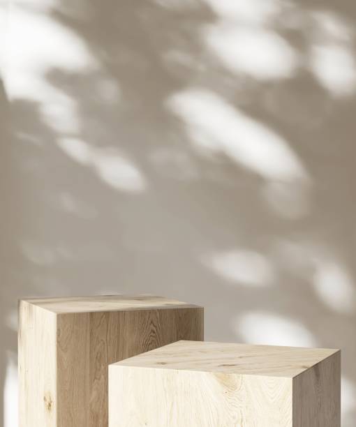 istock Two modern wooden gray cuboid table podium in sunlight on white wall room 2151532391