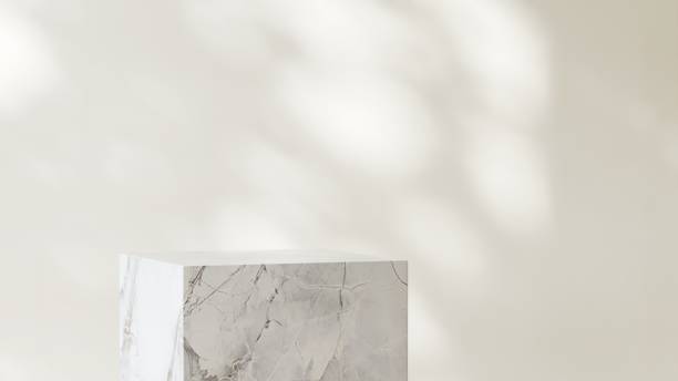 istock Modern marble white cuboid table podium in sunlight on wall room 2151532430