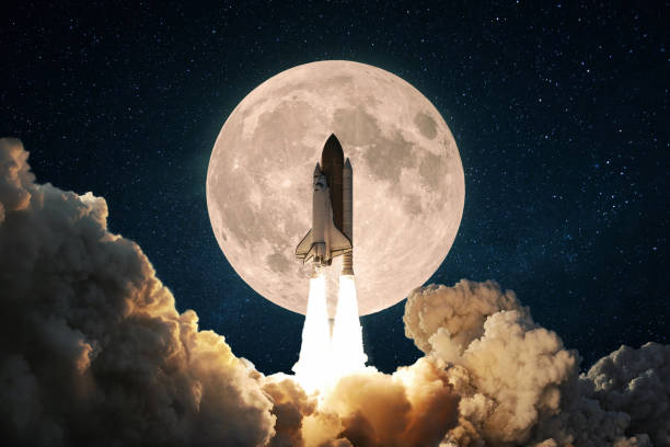 istock New space rocket with smoke and clouds takes off into the sky with full moon. Shuttle spaceship liftoff. Space Mission Launch Concept. 2151536030
