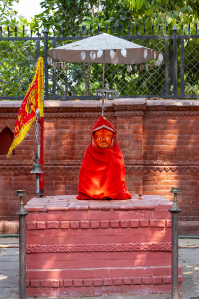 a red statue at the temple