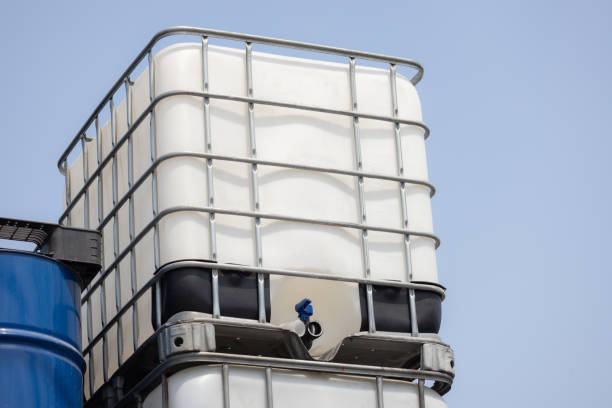 A large white container is stacked on top of another container