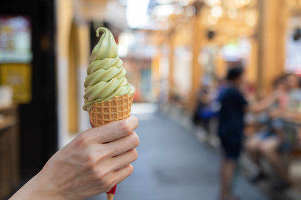 istock A person holding a green ice cream cone 2151540807