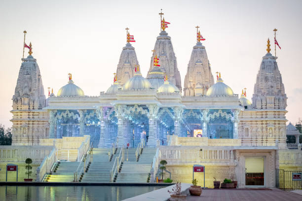 istock BAPS Shri Swaminarayan Mandir Hindu Temple at sunset 2151547017