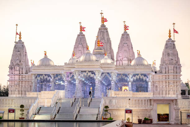 istock BAPS Shri Swaminarayan Mandir Hindu Temple at sunset 2151547025