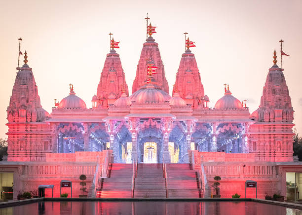 istock BAPS Shri Swaminarayan Mandir Hindu Temple at sunset 2151547030