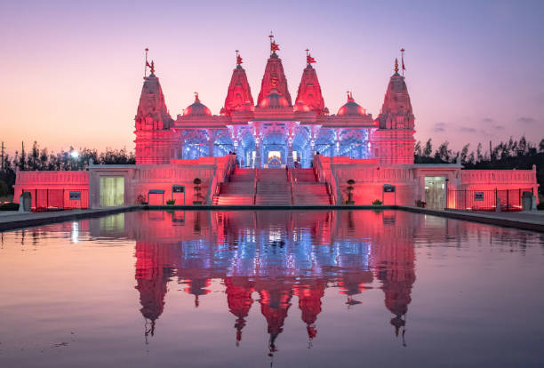 istock BAPS Shri Swaminarayan Mandir Hindu Temple at sunset 2151547039
