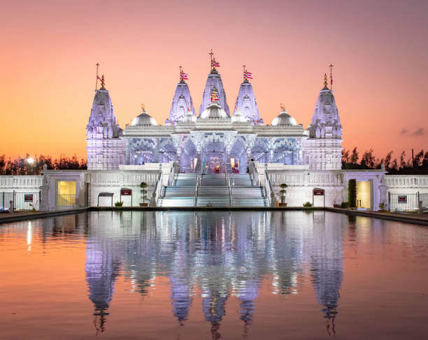 istock BAPS Shri Swaminarayan Mandir Hindu Temple at sunset 2151547040