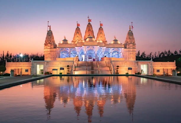 istock BAPS Shri Swaminarayan Mandir Hindu Temple at sunset 2151547045