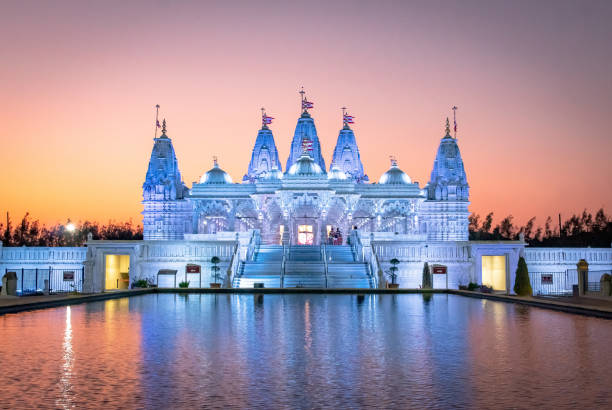 istock BAPS Shri Swaminarayan Mandir Hindu Temple at sunset 2151547046