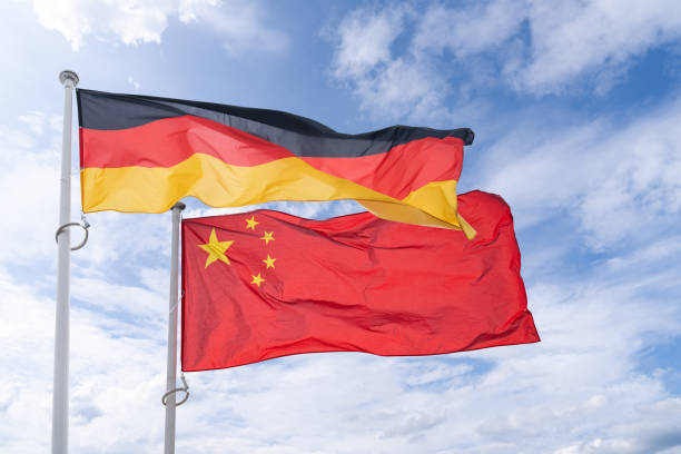 istock German and Chinese flags flutter in the wind 2151547379