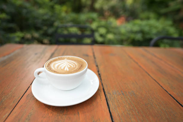 White coffee cup on brown wooden table