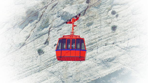 istock Red Cable Car Over Rocky Mountain Aerial View 2151551332