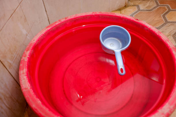 istock A blue dipper in the water in a red container in the bathroom 2151551575