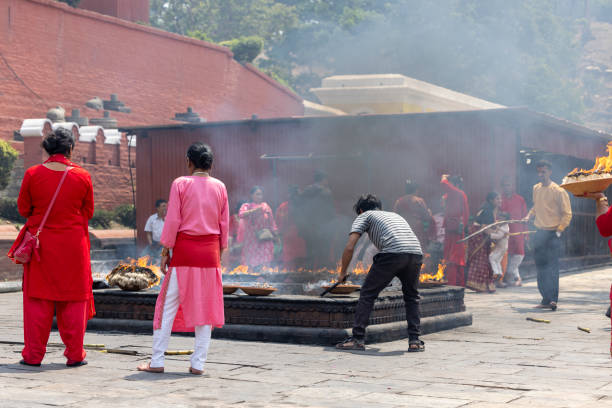 Kathmandu, Nepal-April 22,2024: people making the fire ceremony inside the Pashupatinath temple in the morning