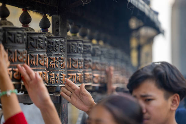 Kathmandu, Nepal-April 22,2024: spinning prayer wheels at the Swayambhunath temple, meditation sessions at these monasteries