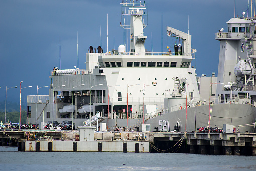 Military ship at the harbour, full frame horizontal composition with copy space