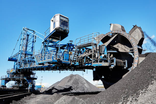 istock Bucket wheel stacker reclaimer  in maritime bulk terminal of coal harbor. 2151557695