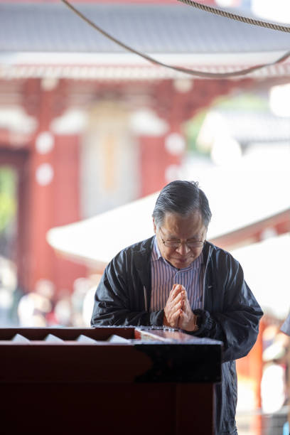 Tokyo, Japan-April 28,2024: prayer ceremony at Sensoji temple, visitors who wish to make a donation usually drop their coins or banknotes into these boxes. This practice is quite common in Japanese culture and can be a spiritual experience for temple visitors. The amount of the donation is at the discretion of the visitor and is usually a personal decision